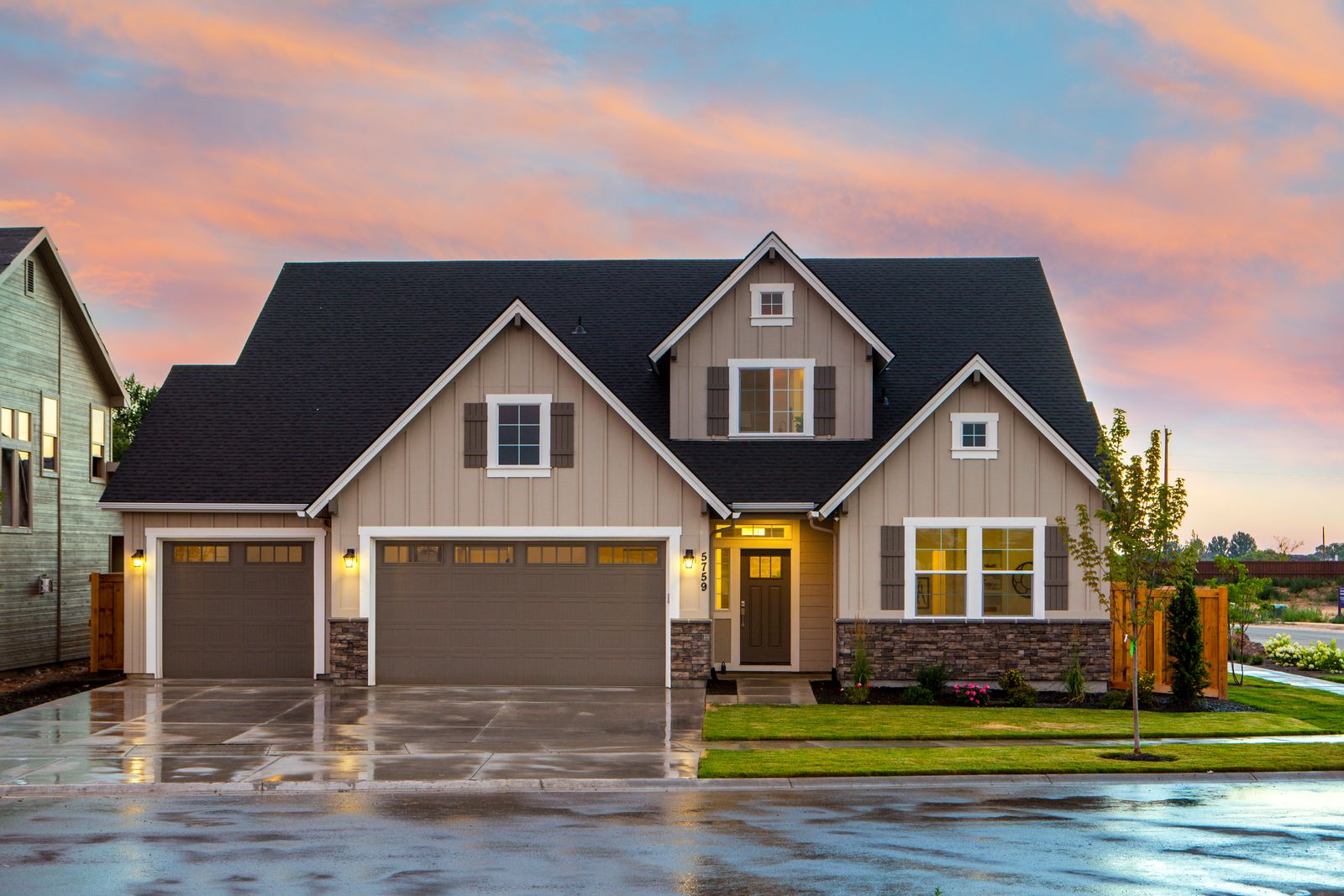 Two-story suburban rental home in Dr. Phillips, Florida at dusk with warm interior lights